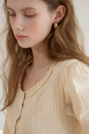 Noteny Round-Neck Frill Blouse