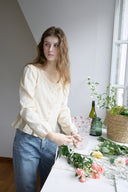 Noteny Round-Neck Frill Blouse