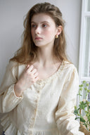 Noteny Round-Neck Frill Blouse