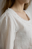 Noteny Round-Neck Frill Blouse